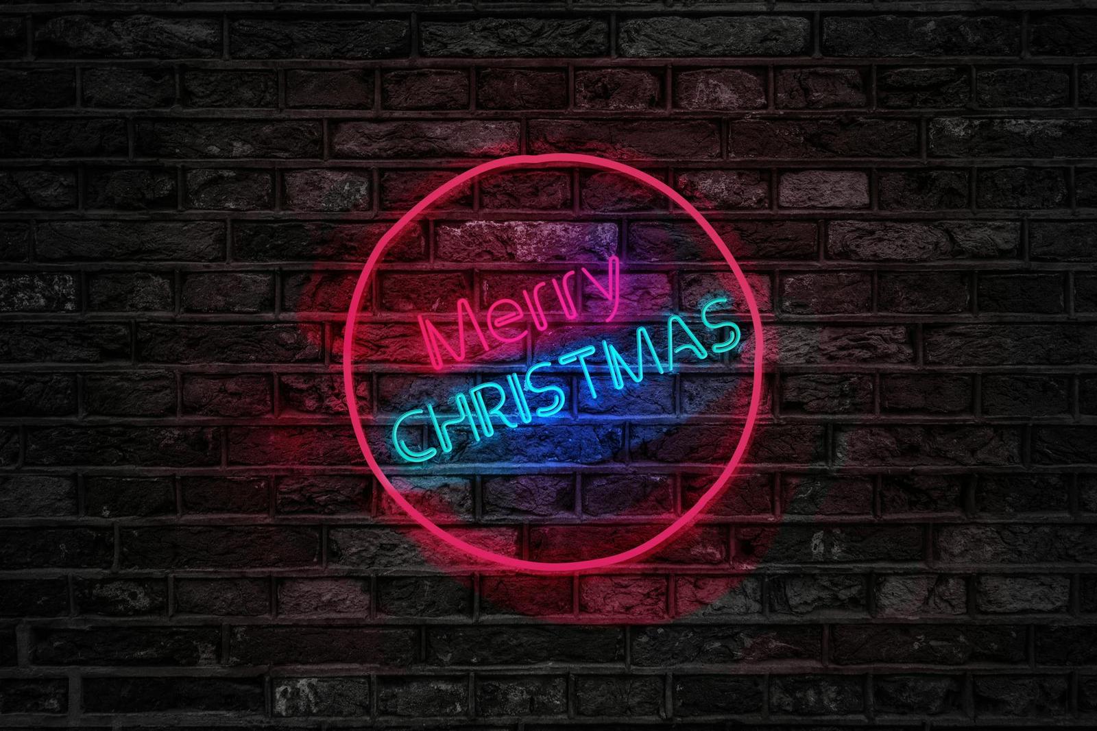 A neon sign saying merry christmas